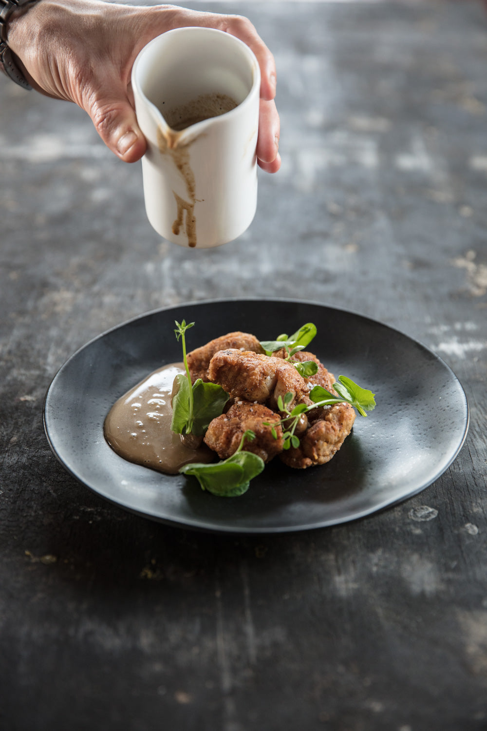Veal sweetbreads with black garlic and a wild mushroom sauce